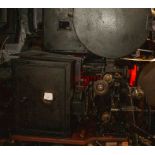 A 35mm movie projector (unidentified). Front shutter, top and bottom arms, 32 teeth sprocket,