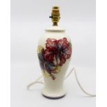 Moorcroft Hibiscus ivory base table lamp, impressed marks and part label to base approx 34 cms tall,