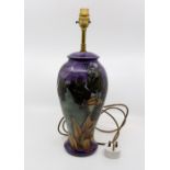 Moorcroft Black Tulip pattern lamp base on a purple ground, approx 45 cms including fitting, circa