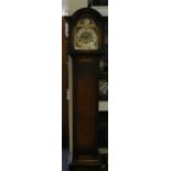An early 20th Century oak grandmother clock, having an eight day movement, striking on gongs, with
