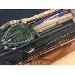 Angling interest: a collection of glass fibre fishing rods, landing nets, etc. (Q)