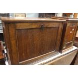 An Arts and Crafts oak coal scuttle brass mounts, together with a small oak cabinet with fall front