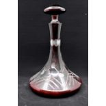 A Cranberry glass decanter and vase.