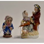 Two 19th Century, Continental figures, comprising an old lady, taking a pinch of snuff, height