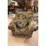 A 20th Century Duresta armchair, floral patterned upholstery raised on oak turn tapered supports