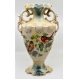 An early 20th Century blush ivory two handled vase, transfer printed decoration depicting birds