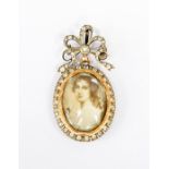 A Victorian/Edwardian miniature portrait pendant/brooch , bow top with a diamond set to the centre