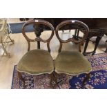 A pair of early Victorian rosewood chairs, circa 1850, open spoon back raised on cabriole legs (2)