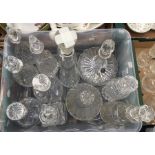 A collection of twelve assorted cut glass decanters, by various makers, various designers, mostly