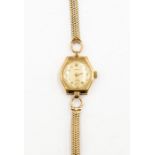 A ladies Peerex 9ct gold wristwatch, 1930's, champagne dial, diameter approx. 17mm,  numbers and