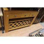 A 21st Century solid oak wine cabinet, rectangular top, three single frieze drawers above a wine