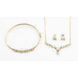 A collection of 9ct gold and blue topaz jewellery to include and a necklace set with oval blue topaz