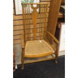 An early 20th Century beech wood children's open armchair, incorporating Georgian design elements,