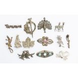 A collection of thirteen silver and white metal marcasite set brooches to include mainly vintage