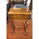 A Victorian style burr walnut sewing table, raised on turned supports and stretchers. 87cm H x