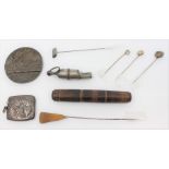 A Lusitania bronze medal, a silver stamp case, a German Army whistle, a needle case, plus hat pins