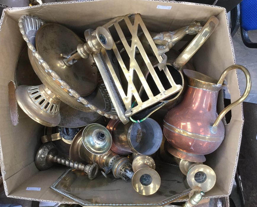 A collection of assorted brass ware, including a pair of Victorian brass candlesticks, a 19th