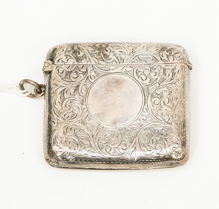 An Edwardian silver vesta, chased with foliate scrolls, vacant cartouche, Birmingham 1908, approx
