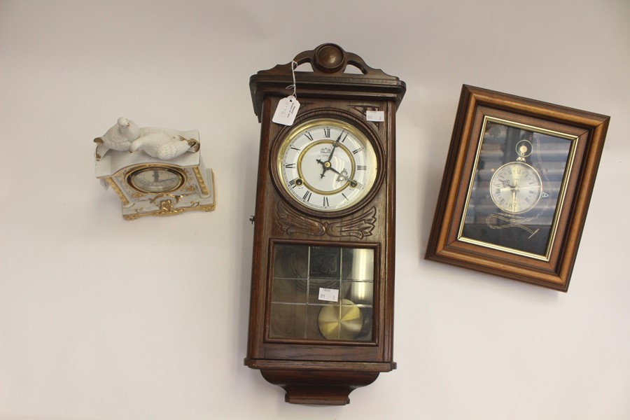 Three modern clocks, comprising, two wall clocks, one a mantle clock.