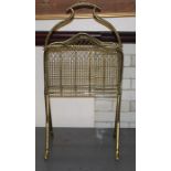 A 19th century brass standing magazine rack