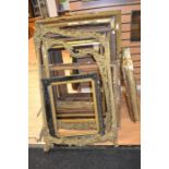 A large collection of substantial Gesso frames in various states of repair