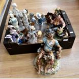A collection of figures including two Capodimonte seated men no: 817 & 873 signed on the bases; a