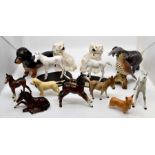 A collection of J Beswick animals including dogs, horses, birds and an elephant Condition: Leg