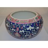 A Chinese bowl, blue ground decorated with green, pink, white and turquoise floral decoration,