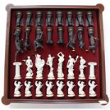 A late 20th Century chess set of the Gods, by Franklin Mint, all pieces in bisque porcelain, stamped