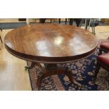 William IV early Victorian mahogany breakfast table, round top, central column, four sprayed legs