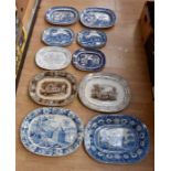 A collection of transfer printed platters in various colours including blue and brown. Patterns