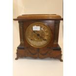 A walnut cased eight day mantle clock.