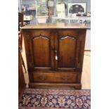 A 20th Century oak Titchmarsh & Goodwin Television cabinet, rectangular top above two panel doors on