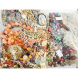 A filled hairpin stand and pins together with costume jewellery and a bag of beads (2)