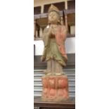 A large wooden figure of a standing buddha, approx 112cm