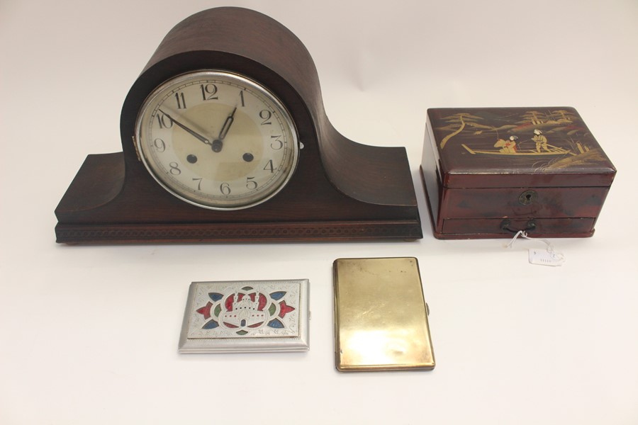 An early 20th Century eight day mantle clock, a Japanese box, a 1947 cigarette case, from Africa