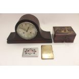 An early 20th Century eight day mantle clock, a Japanese box, a 1947 cigarette case, from Africa