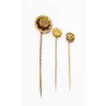 A collection of three stick pins, to include a Victorian diamond set version with 15ct gold terminal