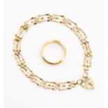 A 22ct gold ring, size L1/2, weight approx. 5.7gms and a 9ct gold gate bracelet with padlock