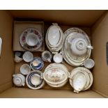 A collection of miniature tea ware items to include hand painted tea cups and saucers, transfer
