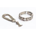 A silver Albertina watch fob bracelet with four chains decorated with embossed clasp and tassel