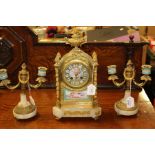 A 19th Century, French, ormolu and porcelain clock garniture, circa 1880, the enamelled and gilded