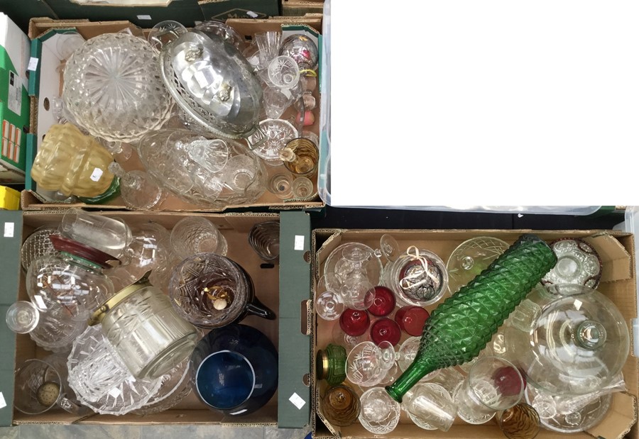 Collection of glassware including cut glass, coloured glass, vases, bowls and bottles etc.