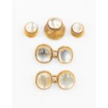 A five piece cuff link and dress stud set, each set with cabochon moonstones set within rope