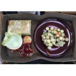 A large red glass bowl along with other coloured glass items together with onyx grapes, lidded box