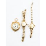 An Edwardian 12ct gold fob watch with white enamel dial and gilt decoration, forget me knot enamel