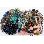 A collection of statement necklaces, including semi-precious stones, lapis lazuli, rose quartz;