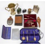 An EPNS trophy; EPNS flatware; manicure set; pen; hip flasks; etc