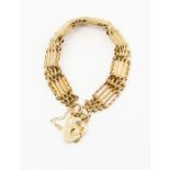 A 9ct gold five bar gate bracelet, textured and plain links, padlock clasp, length approx. 7'',