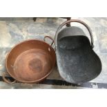 A large copper twin handled cooking pan together with a 19th Century copper coal rod